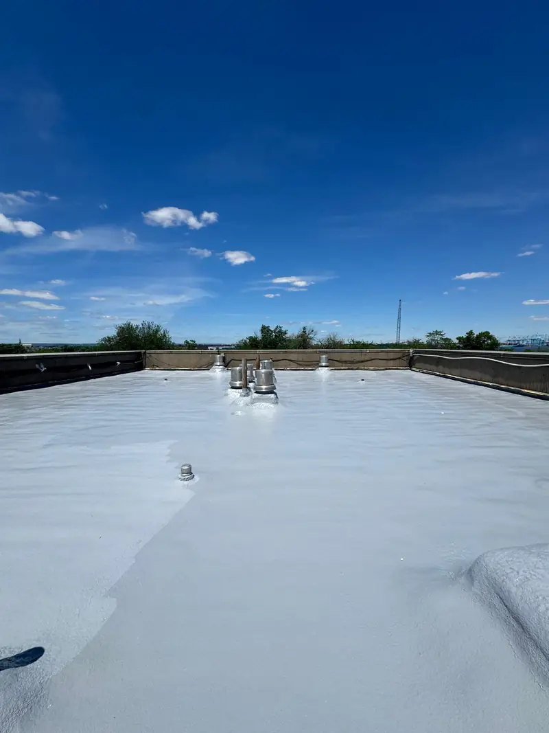 Completed reflective protective coating over a commercial SPF roof