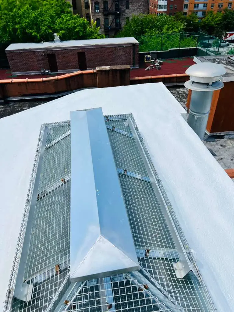 Protective coating completed around a commercial roof penetration